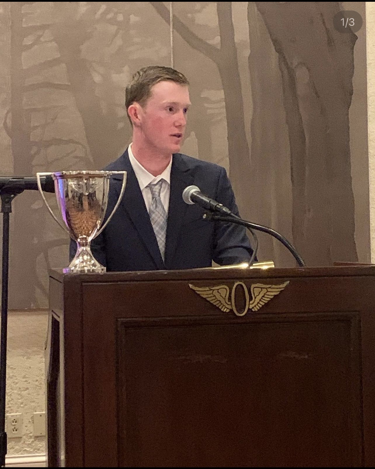 Cameron Keith speaking at an awards ceremony